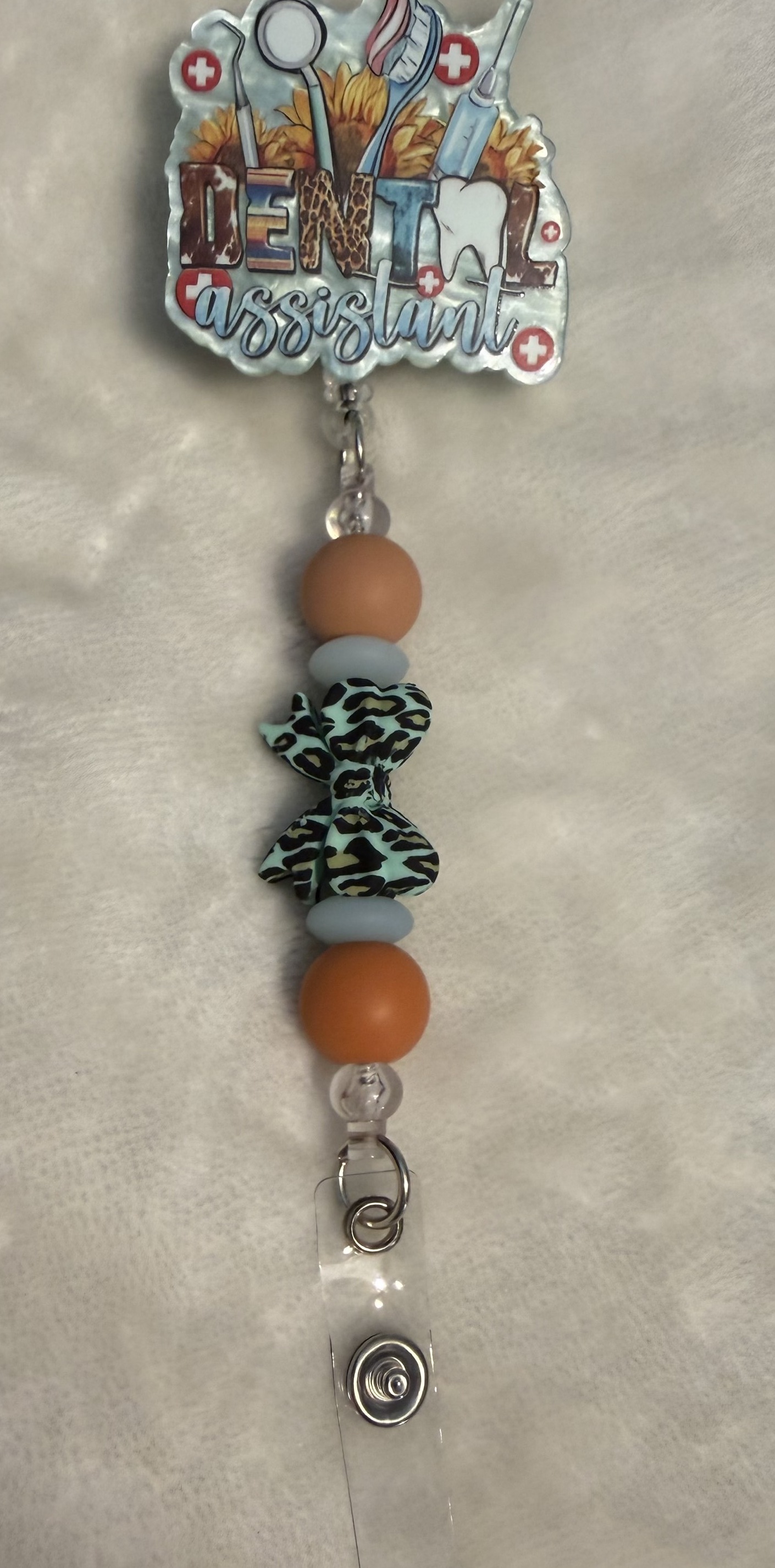 Tied with a Bow, Badge reel by Ain't That Some Crafts
