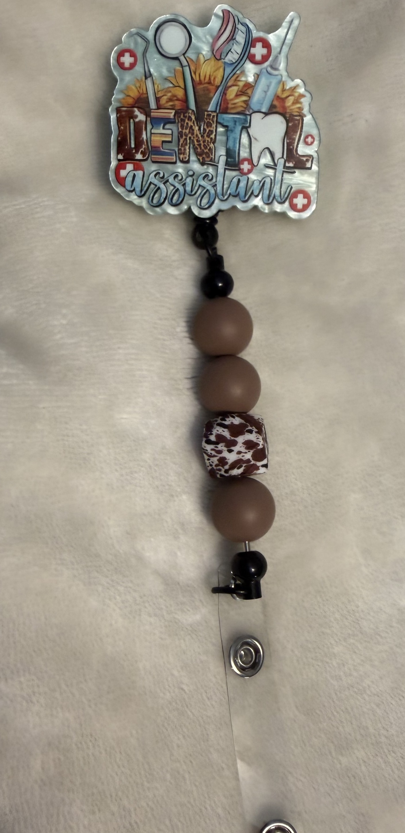Cowhide Assistant, Badge reel by Ain't That Some Crafts